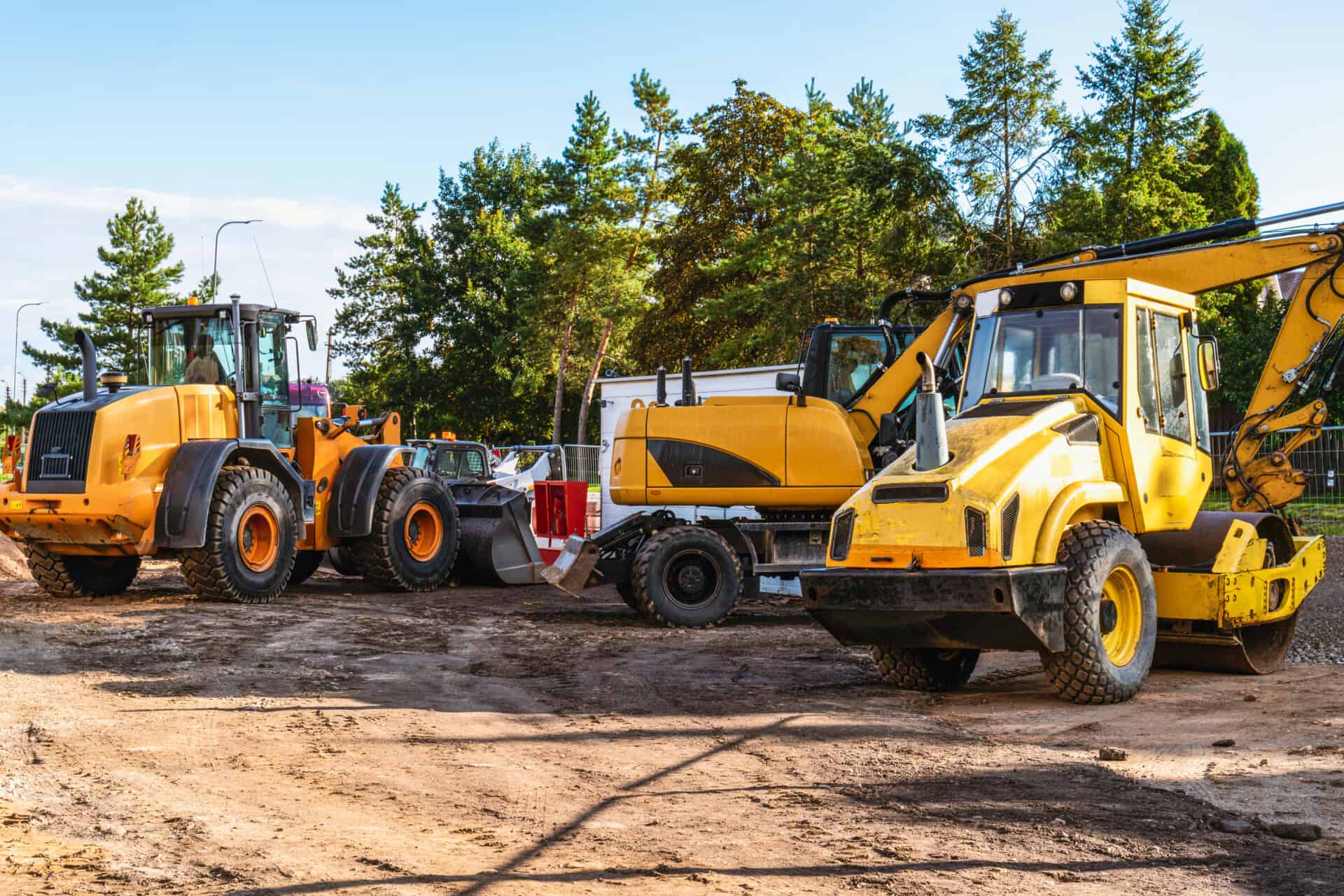 heavy industrial machinery at construction site parking area